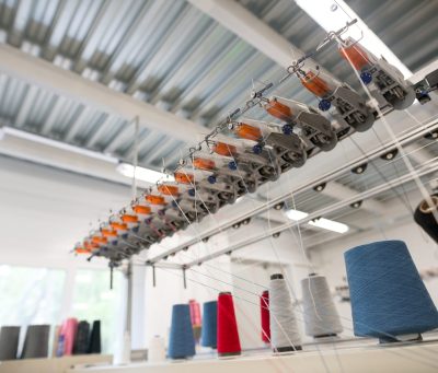 Sewing thread bobbin on machine Sewing thread bobbin in manufactoring plant